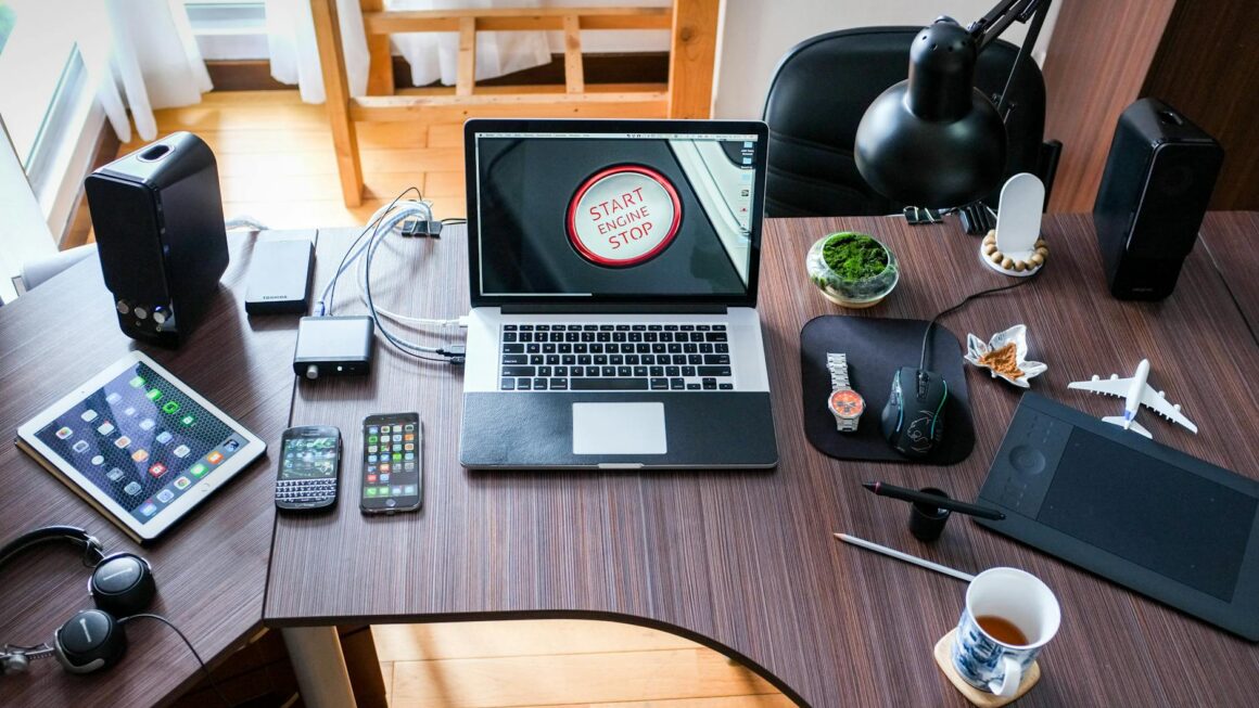 black and white laptop computer on brown wooden desk